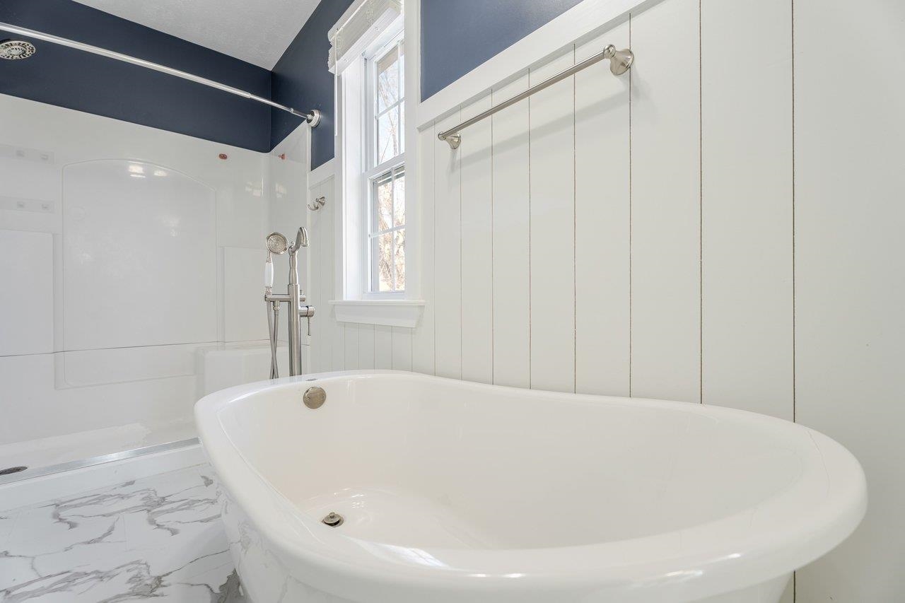 164 Church Street Timberville, VA 22853 - Photo 40 of 68 a white bath tub sitting in a bathroom