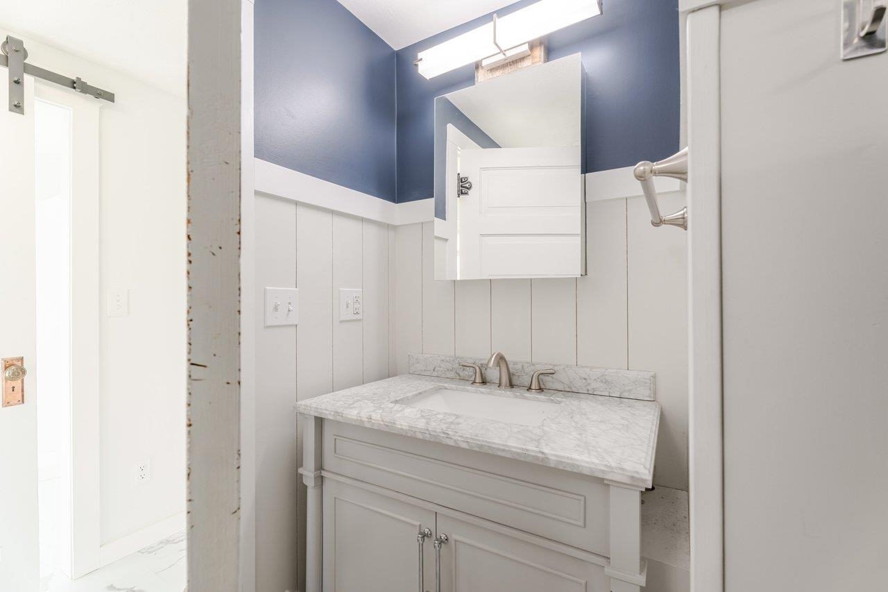 164 Church Street Timberville, VA 22853 - Photo 41 of 68 a bathroom with a granite countertop sink and a mirror