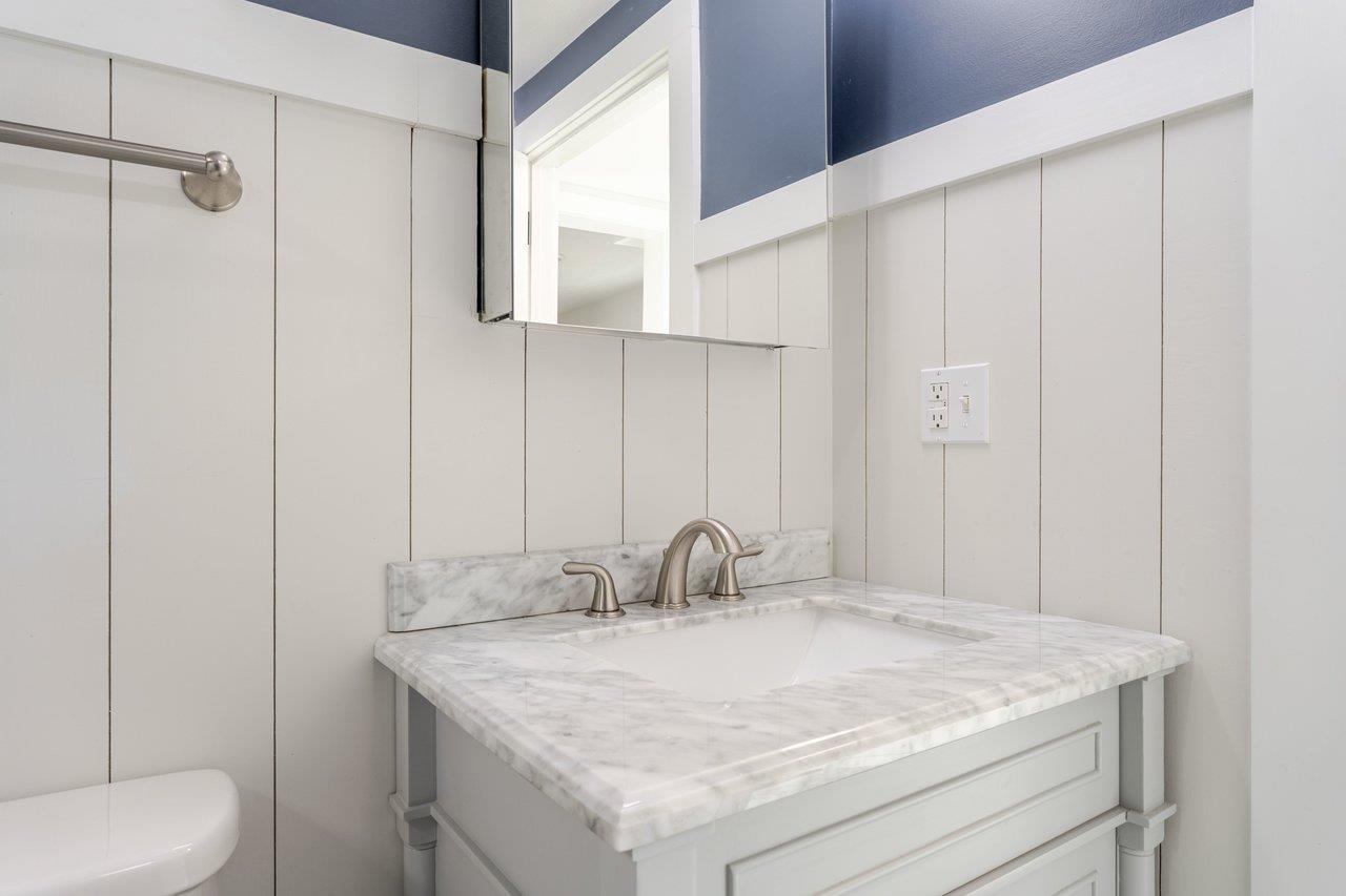 164 Church Street Timberville, VA 22853 - Photo 42 of 68 a bathroom with a granite countertop sink and a mirror