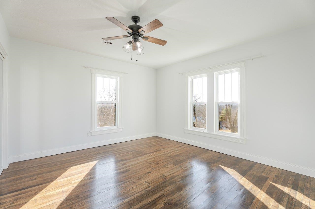 164 Church Street Timberville, VA 22853 - Photo 44 of 68 a view of an empty room with a window and wooden floor