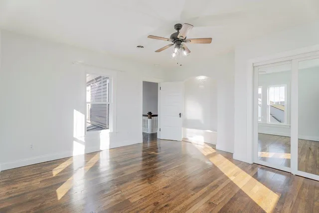 a view of a house with a door and wooden bench