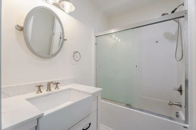 a view of a large pool with an outdoor space and seating area