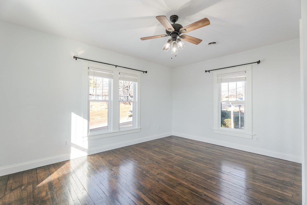 164 Church Street Timberville, VA 22853 - Photo 49 of 68 a view of an empty room with wooden floor and a window