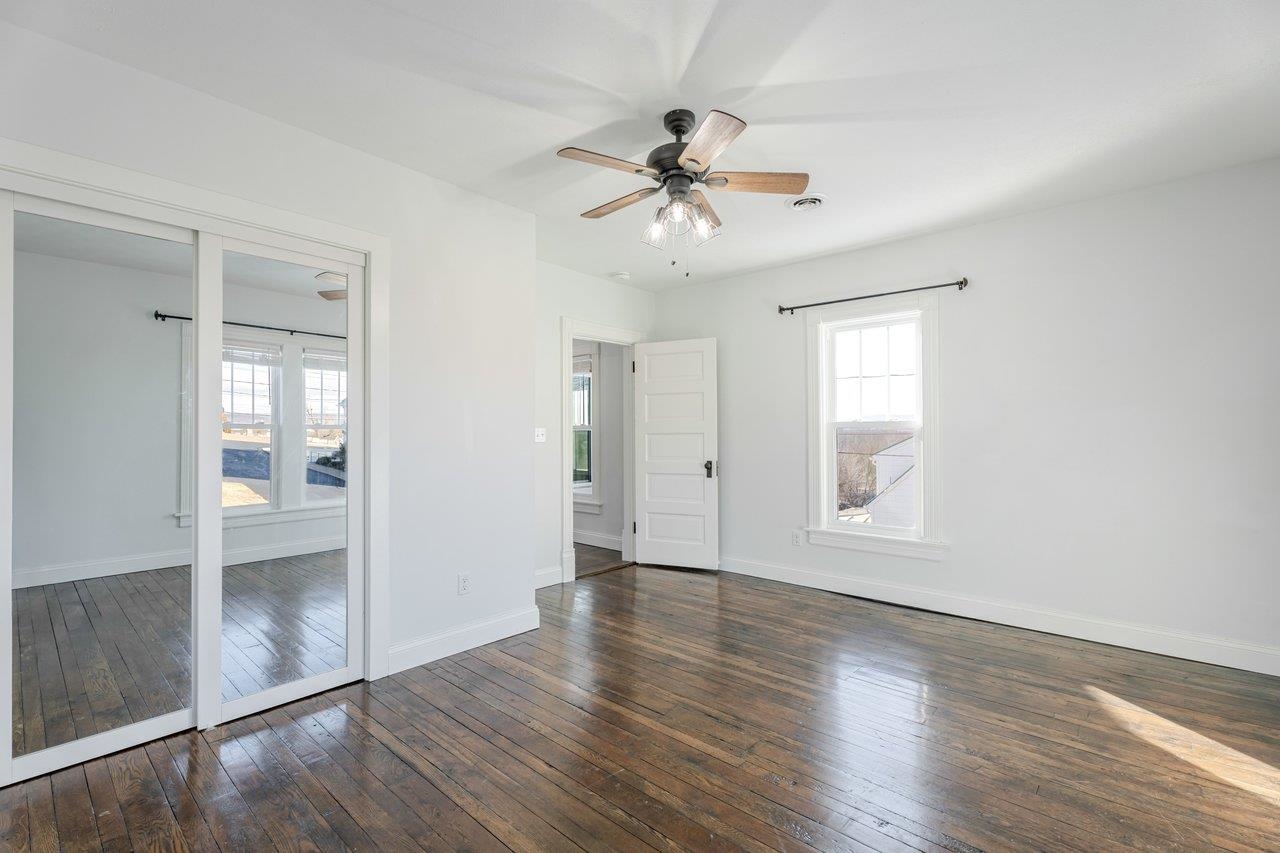 164 Church Street Timberville, VA 22853 - Photo 50 of 68 a view of an empty room with wooden floor and a window