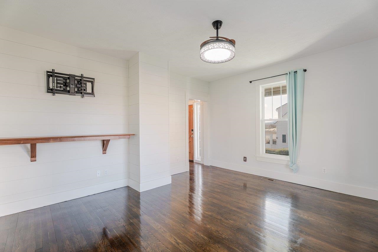 164 Church Street Timberville, VA 22853 - Photo 7 of 68 an empty room with wooden floor and window