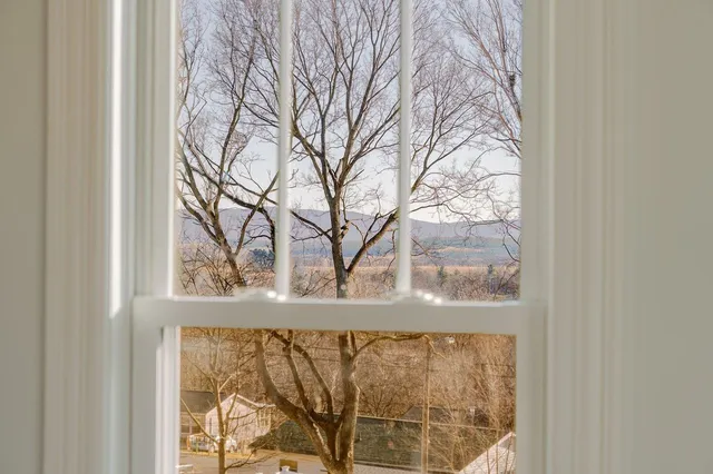 a kitchen with a center island appliances and cabinets