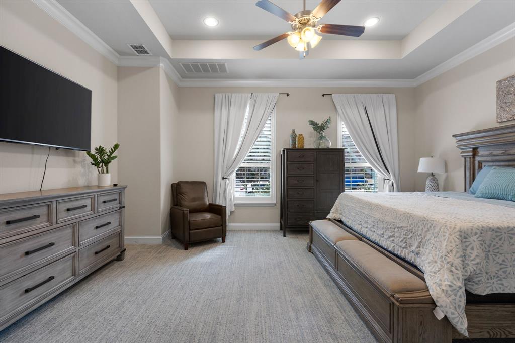 1806 Evening Star Road Frisco, TX 75033 - Photo 26 of 38 Carpeted bedroom with ornamental molding, ceiling fan, and a tray ceiling