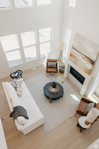 5902 Canyon Rim Road, Unit 620 Lehi, UT 84048 - Photo 27 of 78 Spacious living area featuring high ceilings, light wood-finish flooring, and multiple large windows