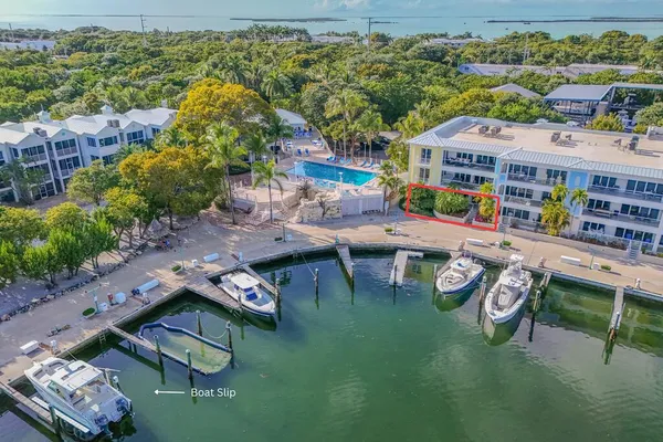 an aerial view of a house with a big yard