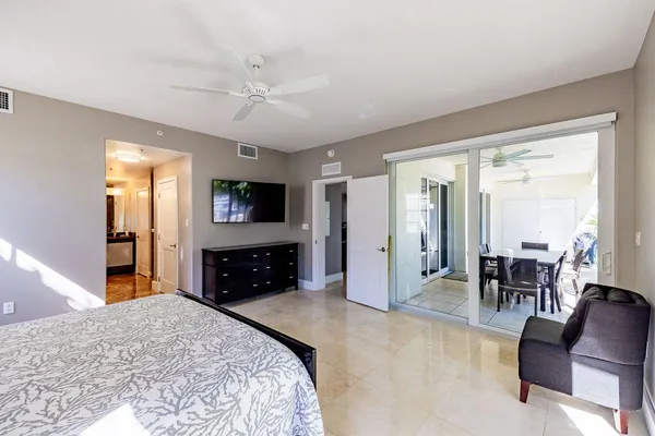 a bathroom with a glass shower door and a window
