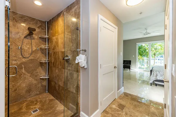a bathroom with a tub and shower