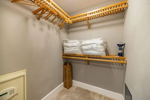 a bedroom with a bed and a television