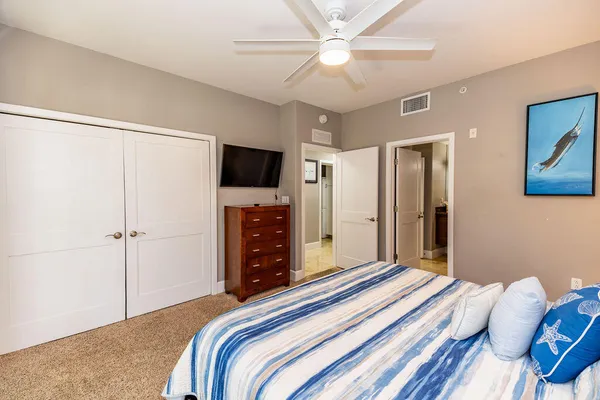 a spacious bedroom with a bed and window