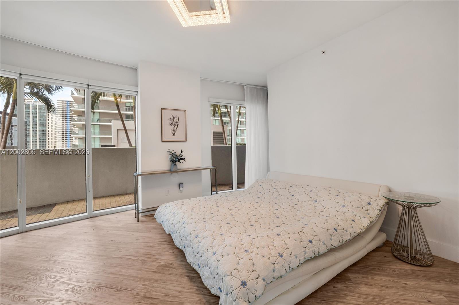 60 Southwest 13th Street, Unit 1124 Miami, FL 33130 - Photo 15 of 30 a bedroom with a bed and window
