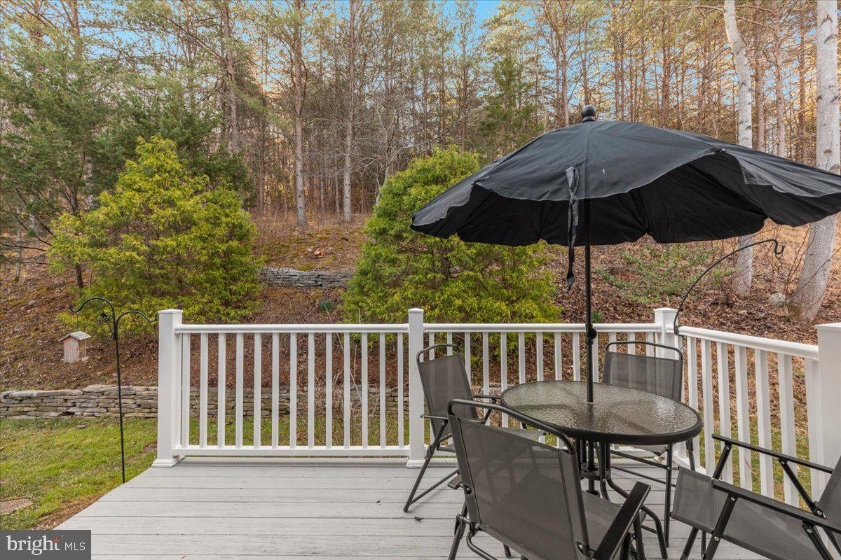 209 Park Ridge Court Front Royal, VA 22630 - Photo 43 of 60 a view of a deck with furniture and barbeque oven in the backyard
