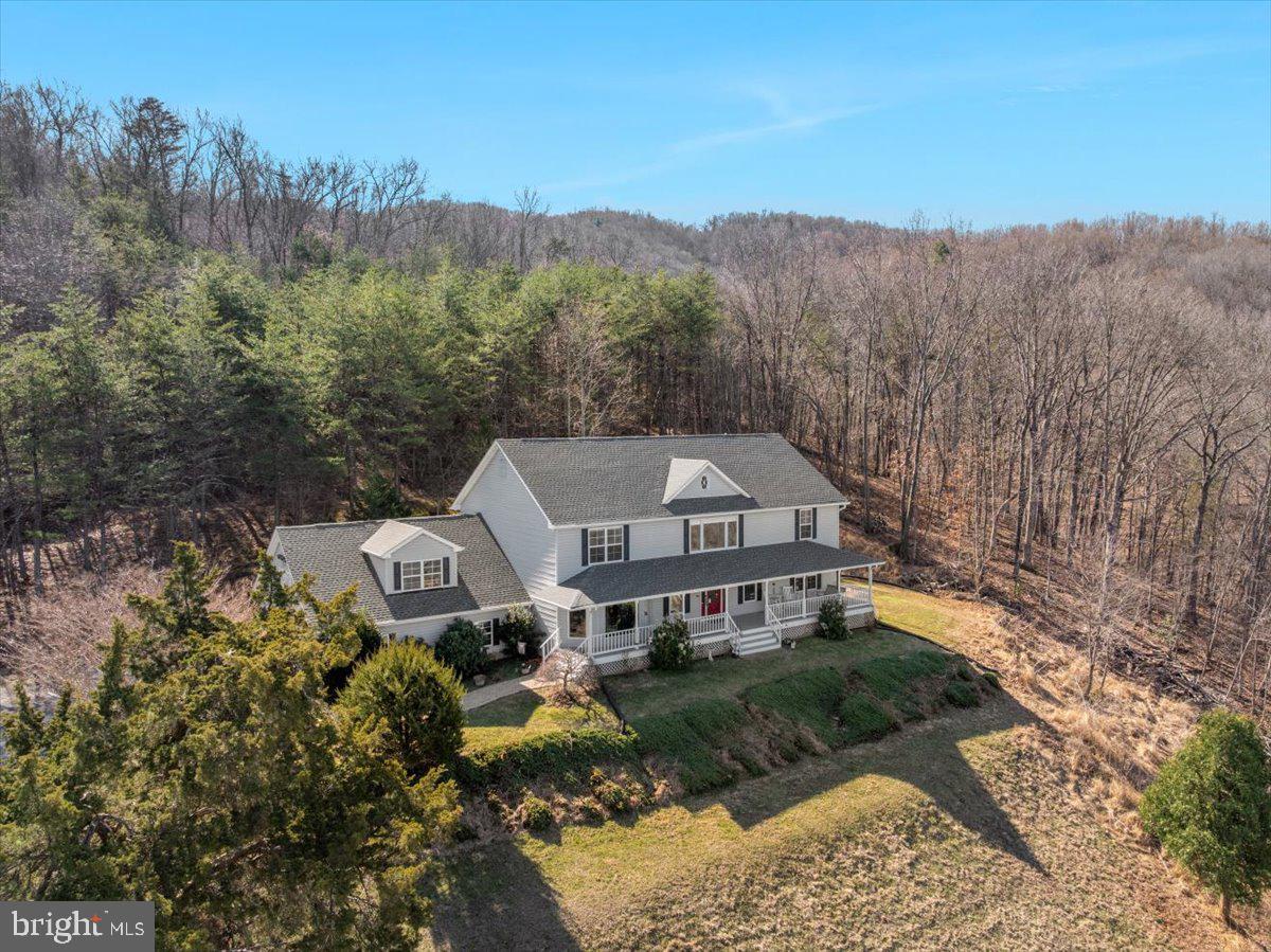 209 Park Ridge Court Front Royal, VA 22630 - Photo 50 of 60 a front view of a house with a yard and mountain view in back