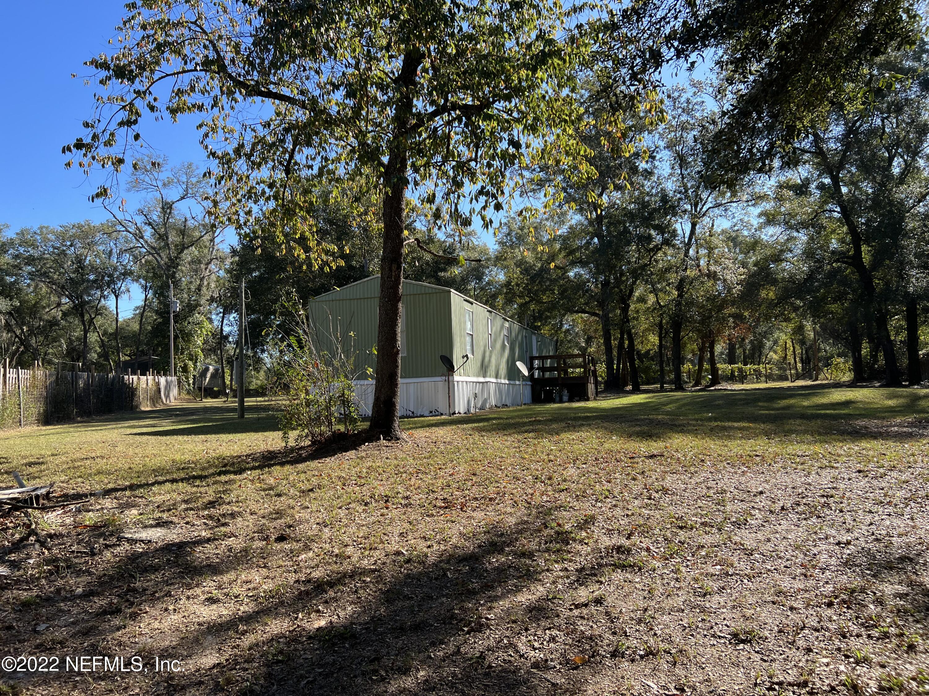 8008 Sunnybrook Road Melrose, FL 32666 - Photo 17 of 17 a view of a yard with plants and trees