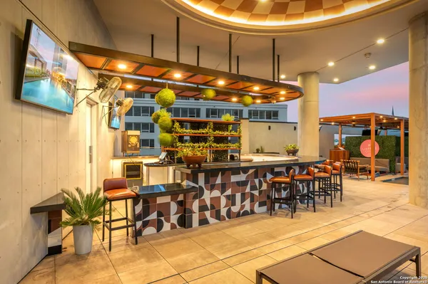 a view of a patio with a dining table and chairs