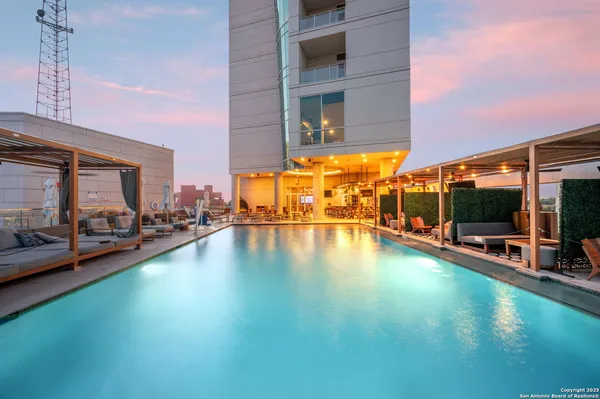 a view of a swimming pool with a patio