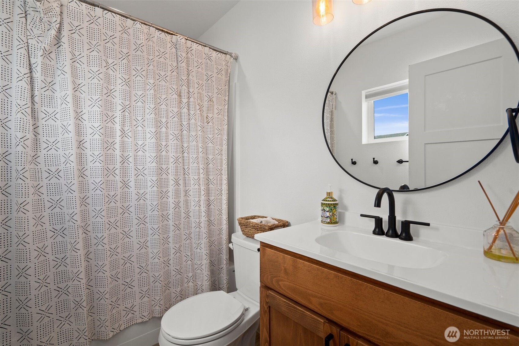 1013 Peach Road, Unit A & B Winlock, WA 98596 - Photo 19 of 30 a bathroom with a sink a toilet and mirror