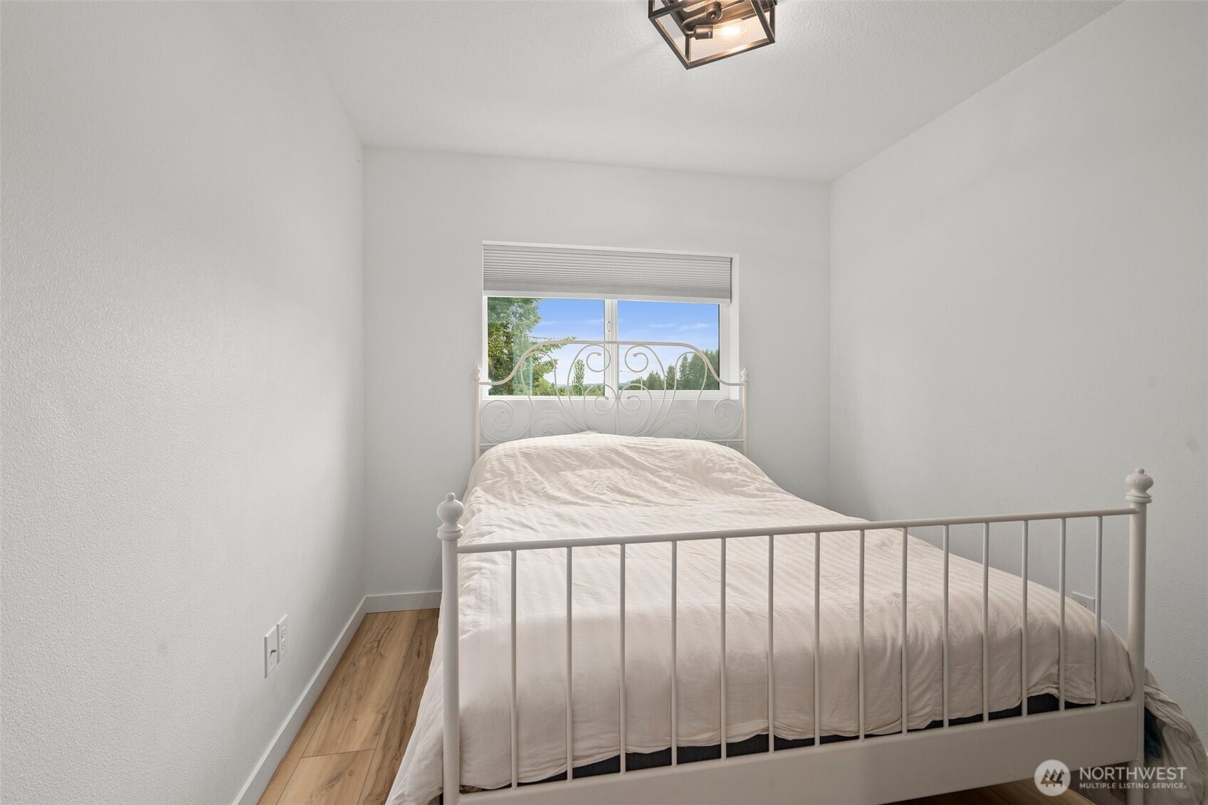 1013 Peach Road, Unit A & B Winlock, WA 98596 - Photo 20 of 30 a bed sitting in a bedroom next to a window