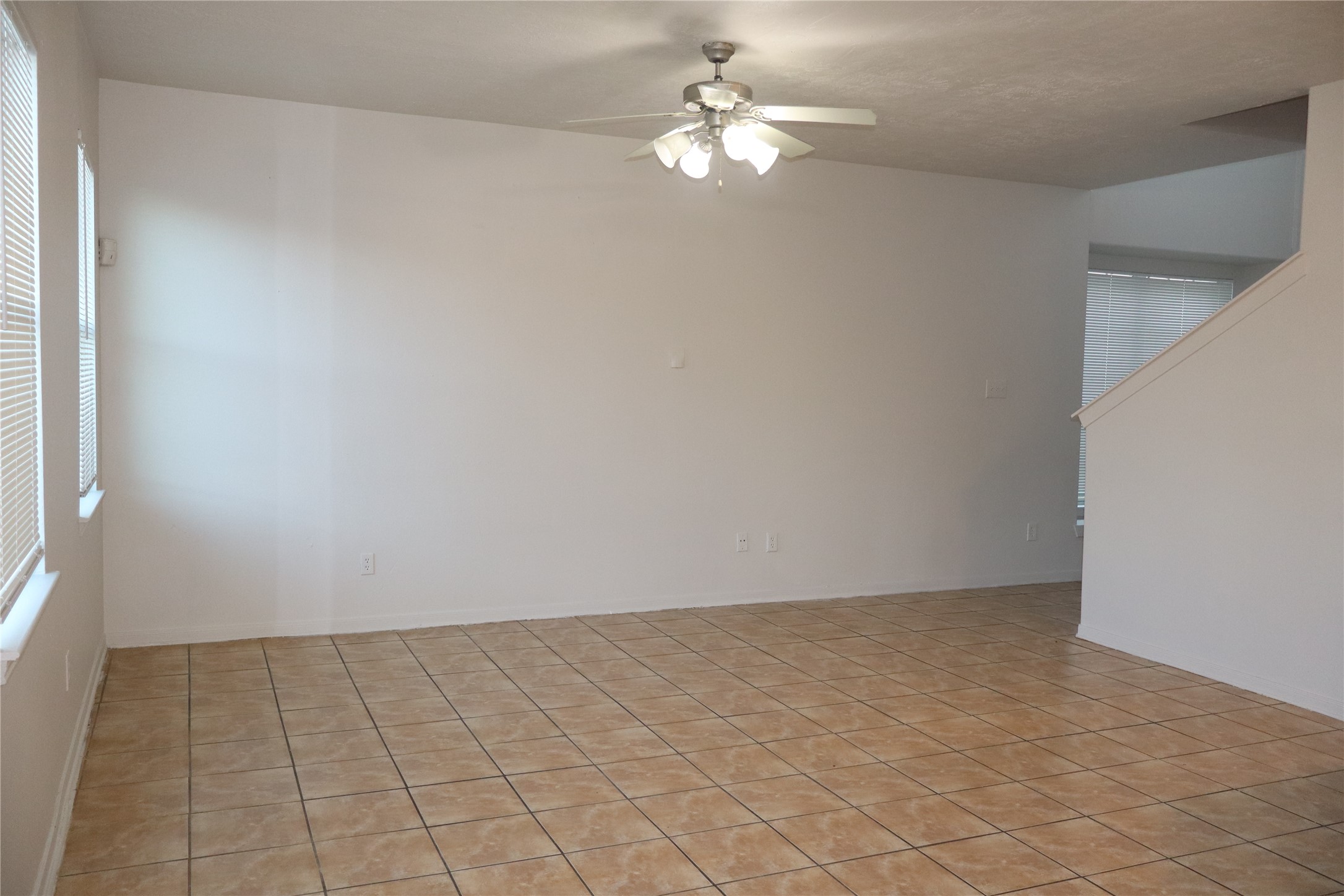 15931 Winston Point Lane Houston, TX 77084 - Photo 2 of 15 en empty room with white walls