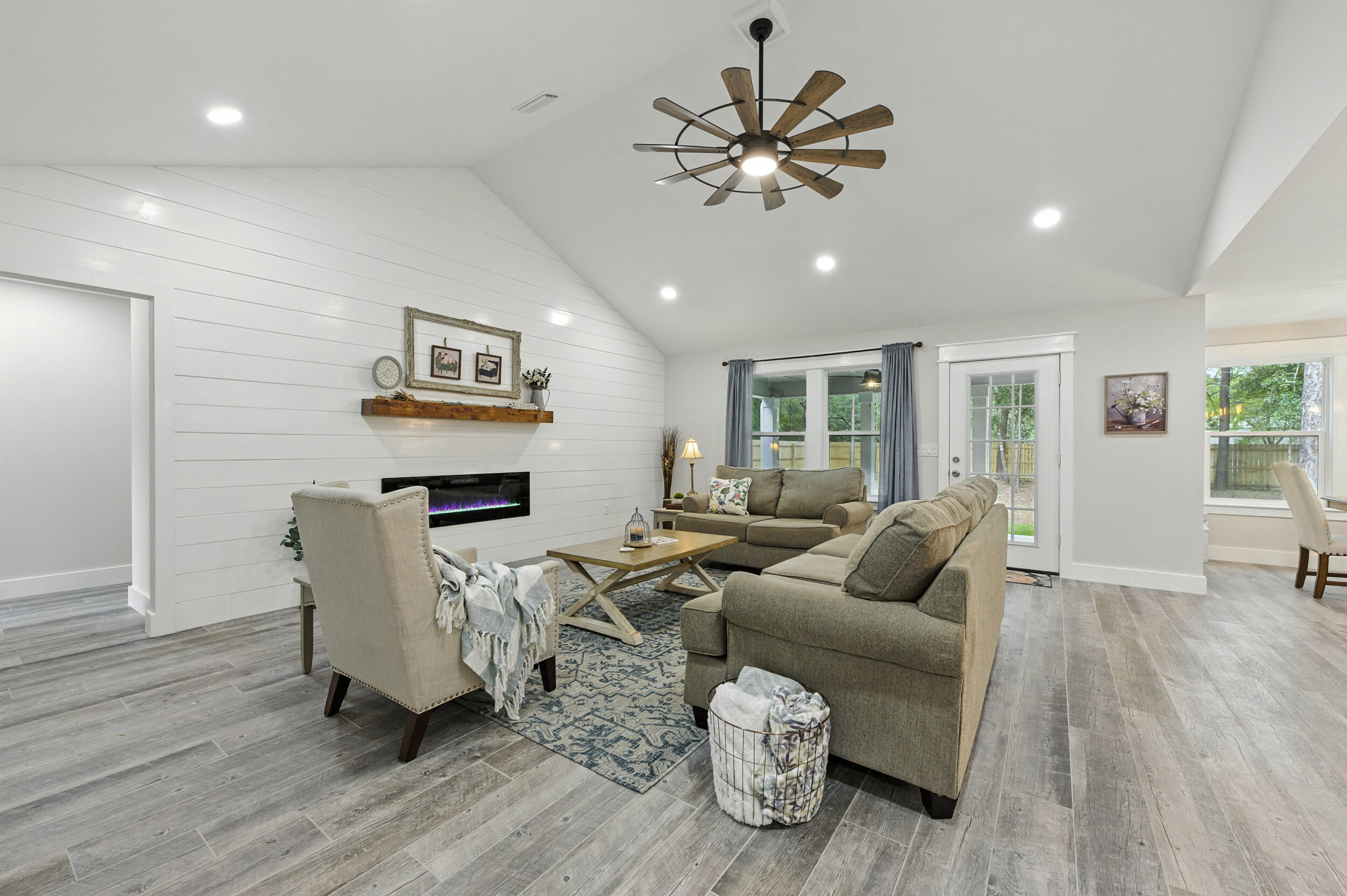 172 Frazier Road DeFuniak Springs, FL 32433 - Photo 13 of 78 a living room with furniture and a wooden floor