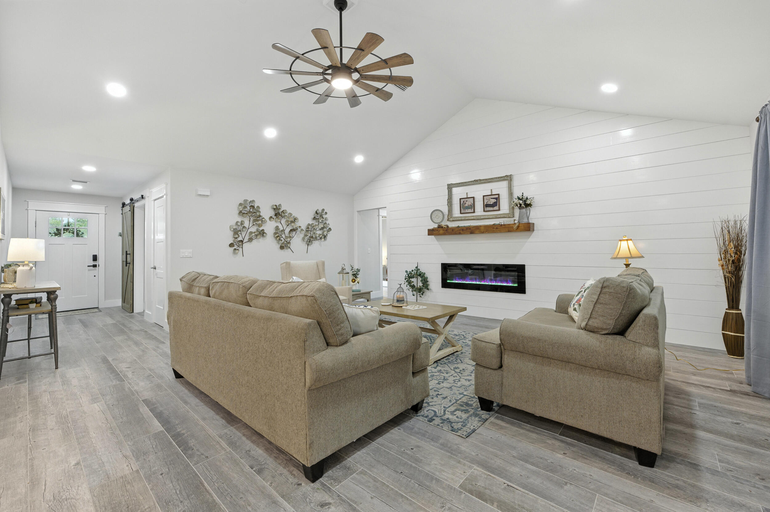 172 Frazier Road DeFuniak Springs, FL 32433 - Photo 16 of 78 a living room with furniture and a fireplace