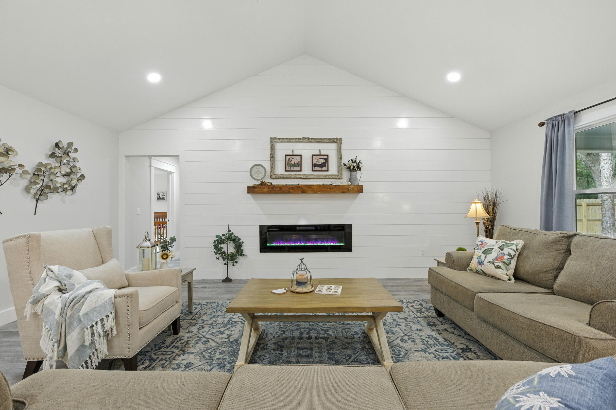 172 Frazier Road DeFuniak Springs, FL 32433 - Photo 17 of 78 a living room with furniture and a fireplace