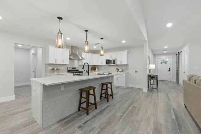 a kitchen with a sink and cabinets