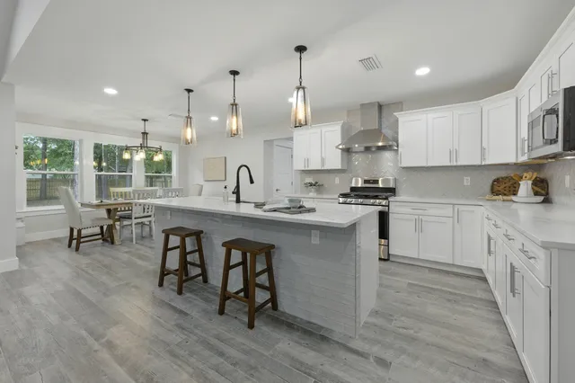 a spacious bedroom with a bed and window