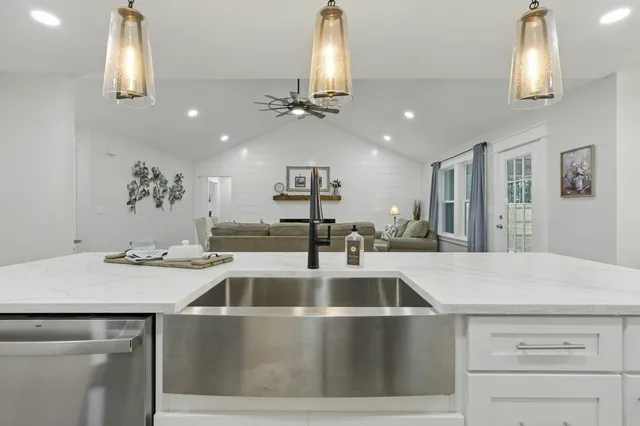 a bathroom with double sink and a mirror