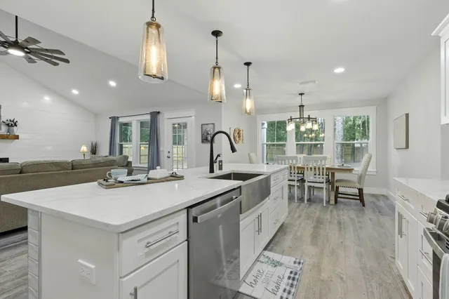 a bathroom with mirror and vanity