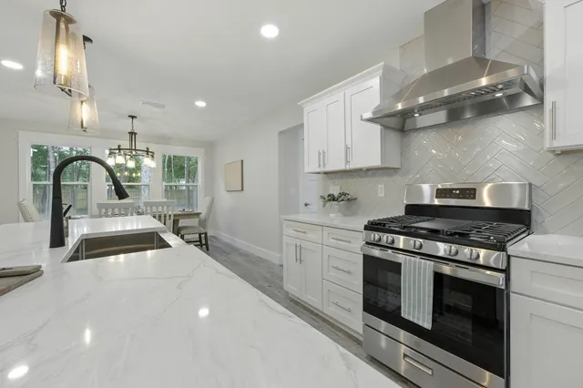 a bathroom with a shower and a sink