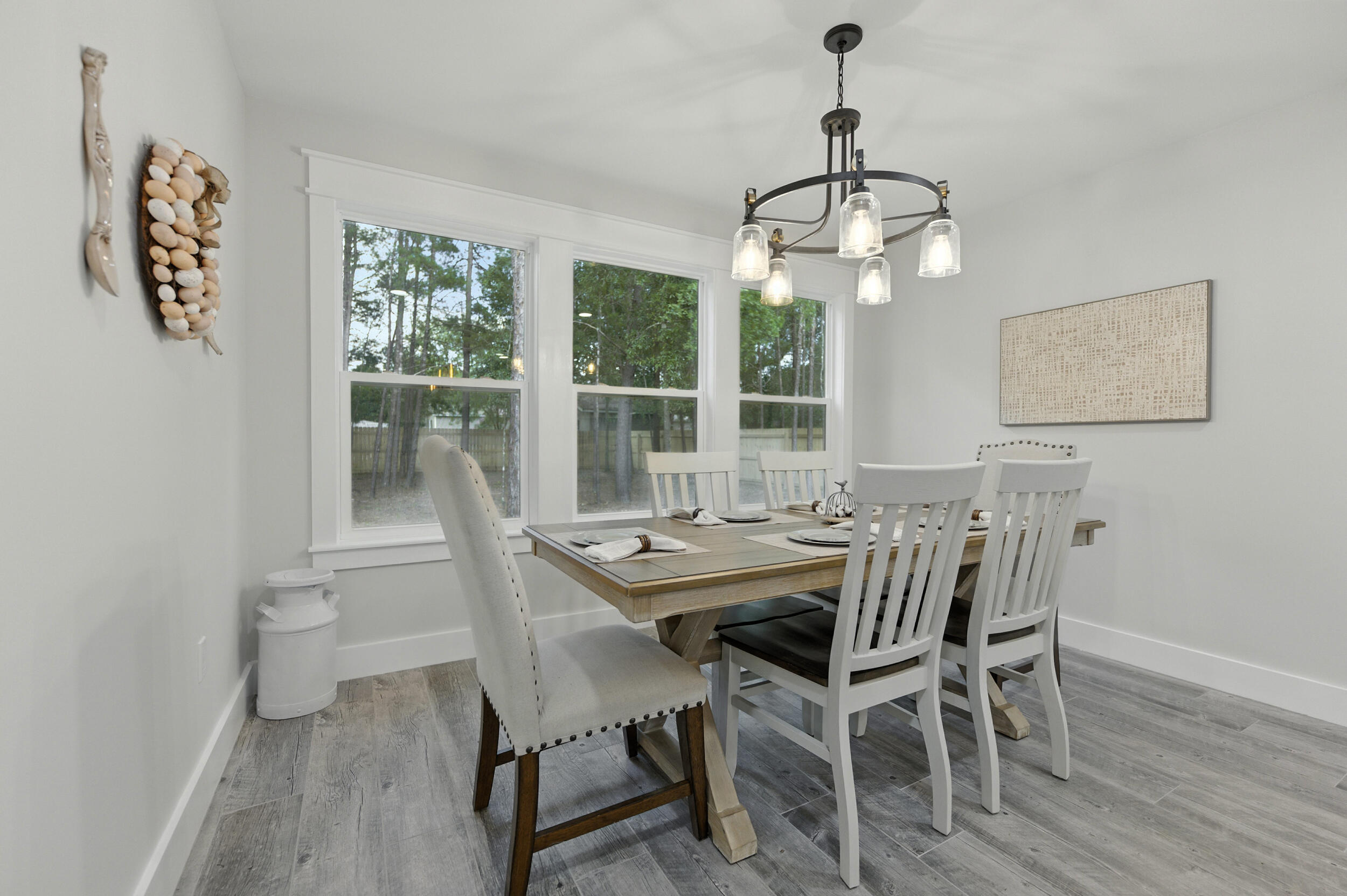 172 Frazier Road DeFuniak Springs, FL 32433 - Photo 29 of 78 a view of a dining room with furniture wooden floor and a chandelier
