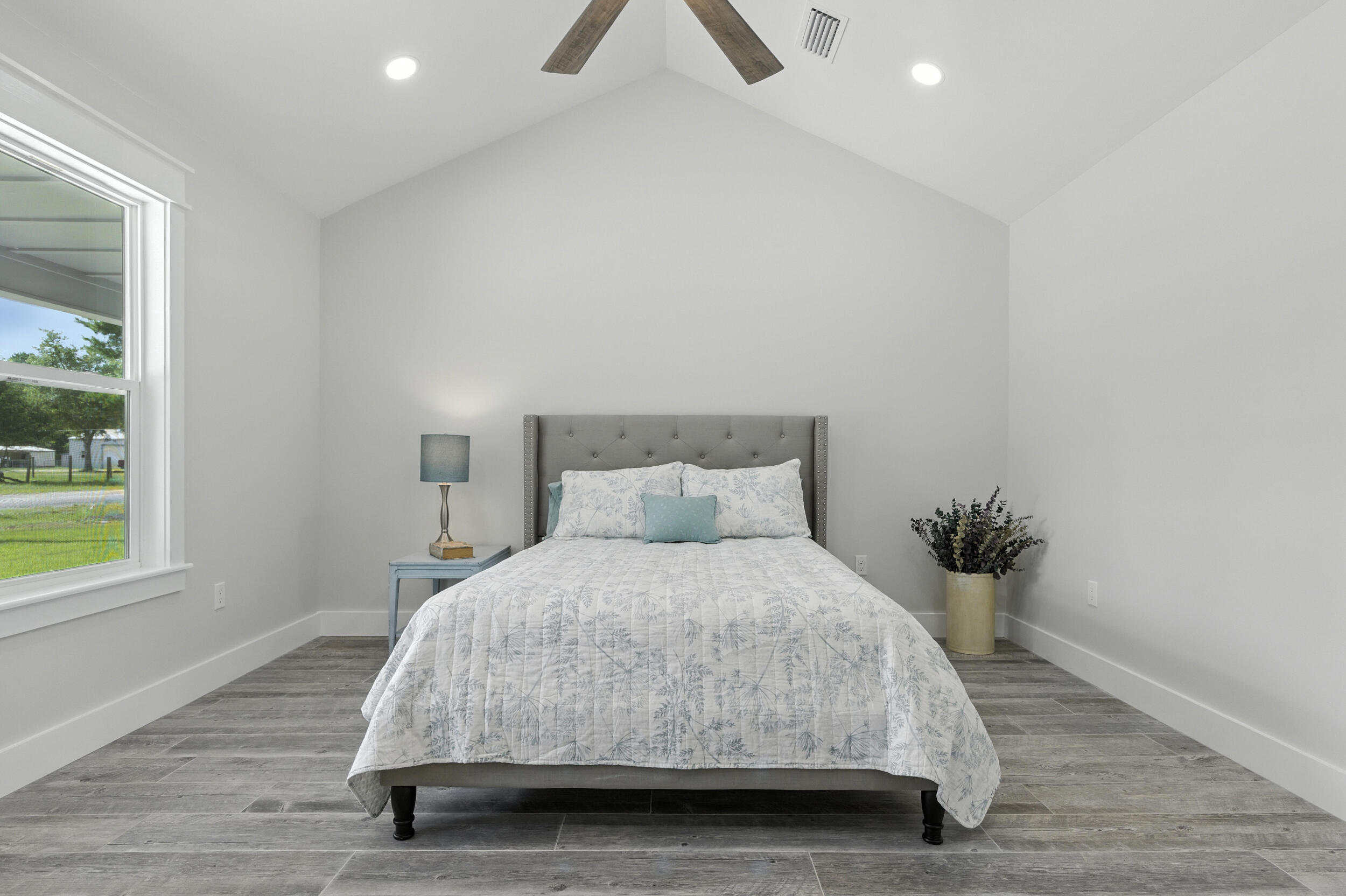 172 Frazier Road DeFuniak Springs, FL 32433 - Photo 34 of 78 a bedroom with a bed and a window