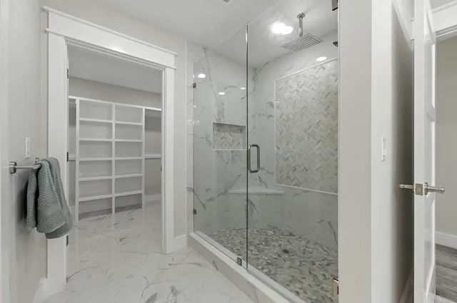 a bathroom with a toilet a sink a tub and mirror