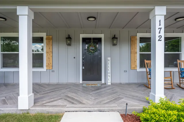a view of a livingroom with furniture and a window