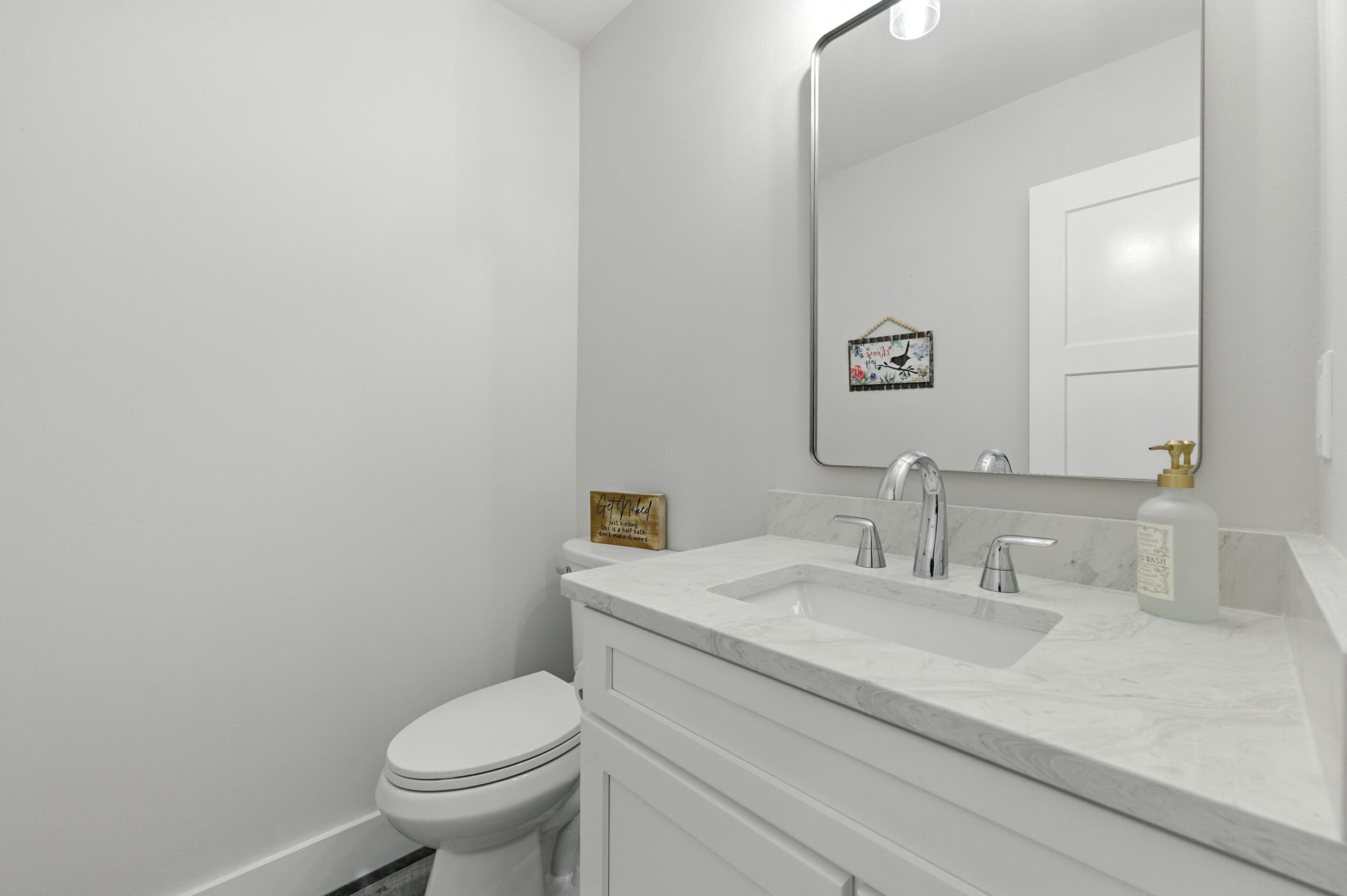 172 Frazier Road DeFuniak Springs, FL 32433 - Photo 48 of 78 a bathroom with a granite countertop toilet and a sink