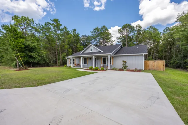 a dining room with wooden floor and a window