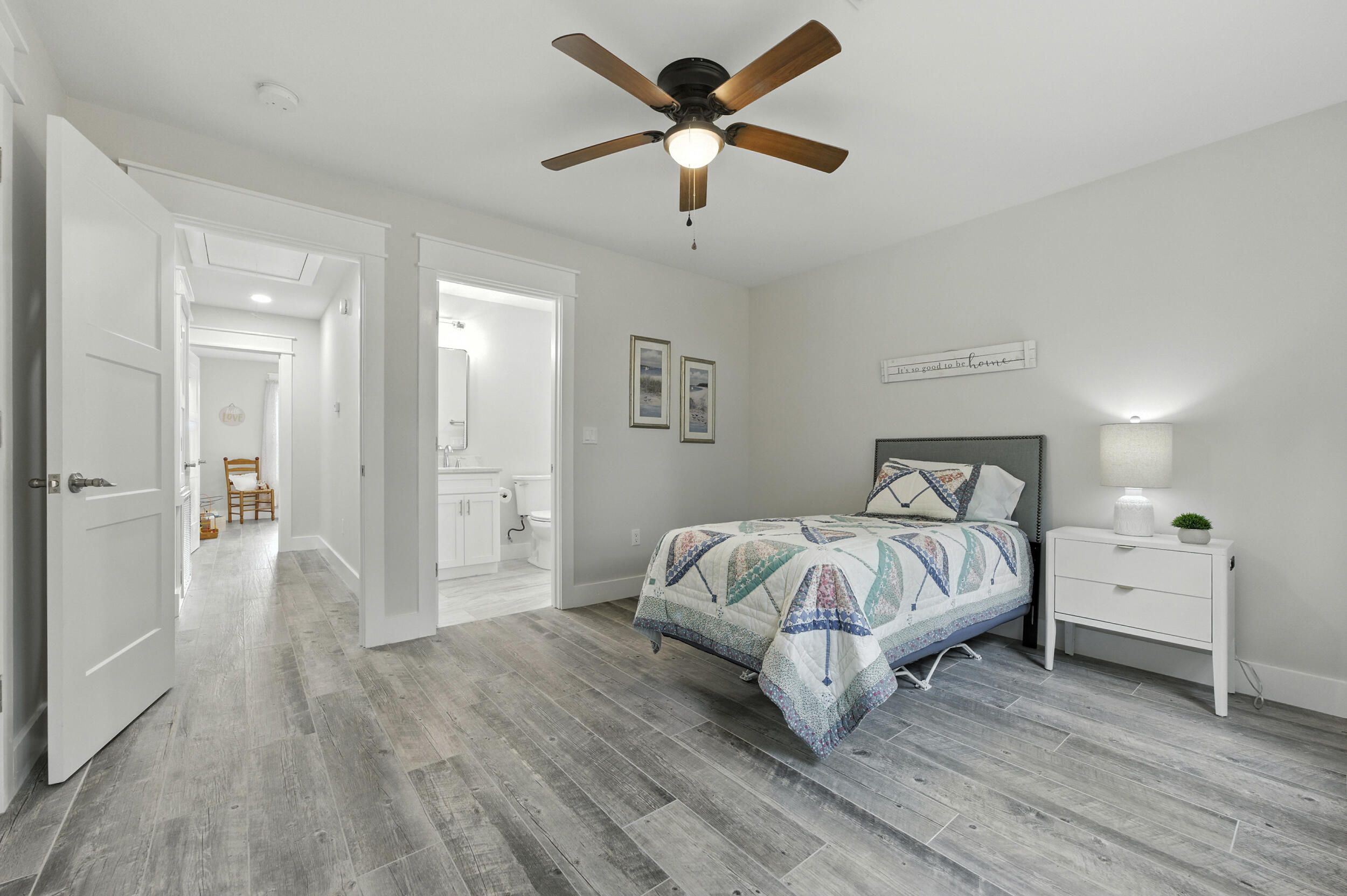 172 Frazier Road DeFuniak Springs, FL 32433 - Photo 58 of 78 a spacious bedroom with a bed and a chandelier