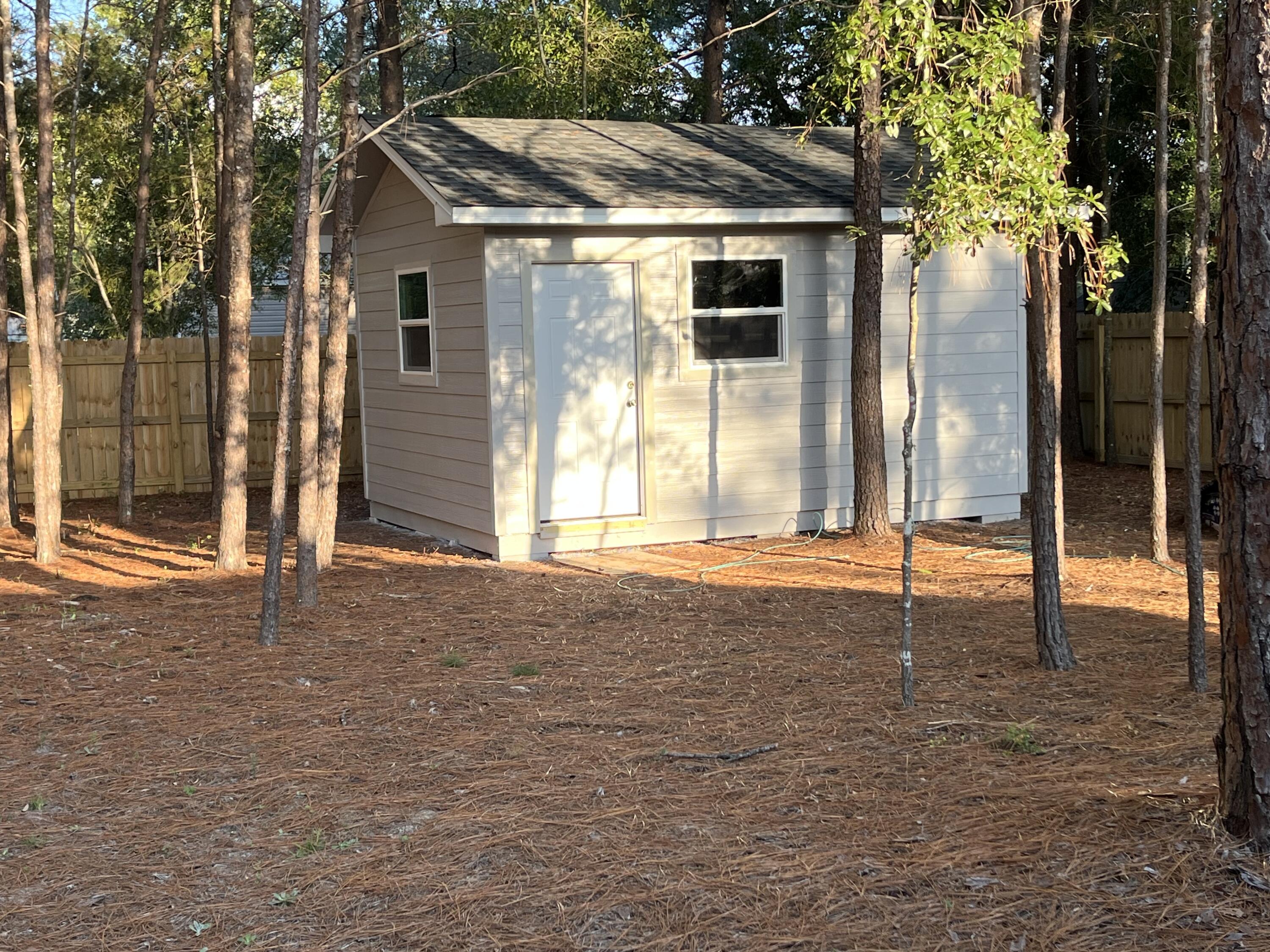 172 Frazier Road DeFuniak Springs, FL 32433 - Photo 77 of 78 a house with trees in front of it