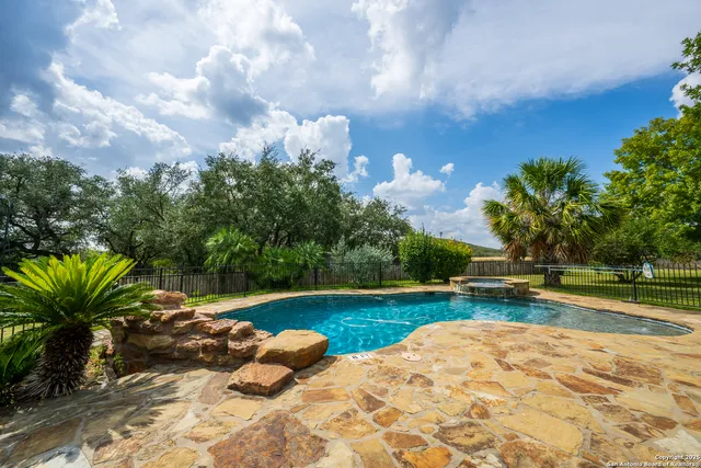 a view of swimming pool with seating space