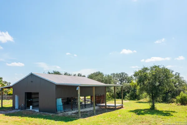 a view of a swimming pool with an outdoor space and seating area