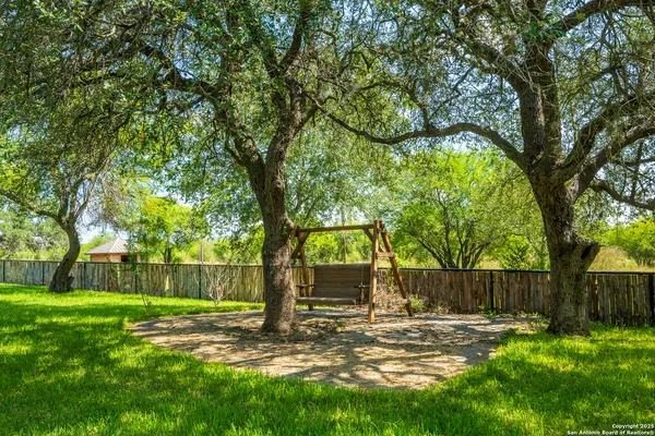 a view of a lake with houses in the background