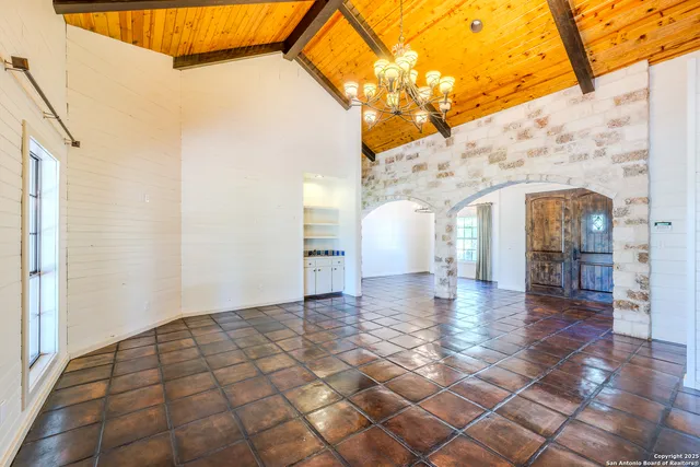 a view of a white house with a outdoor space