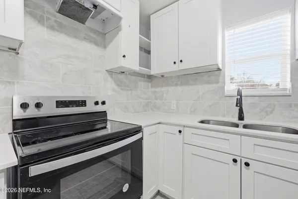 a view of kitchen with stove