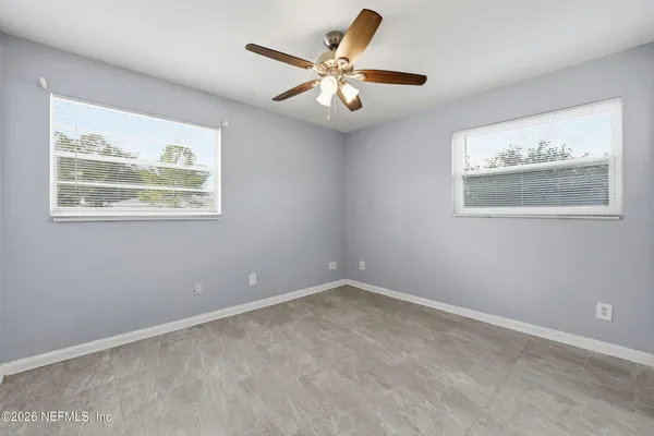 a view of an empty room with a window