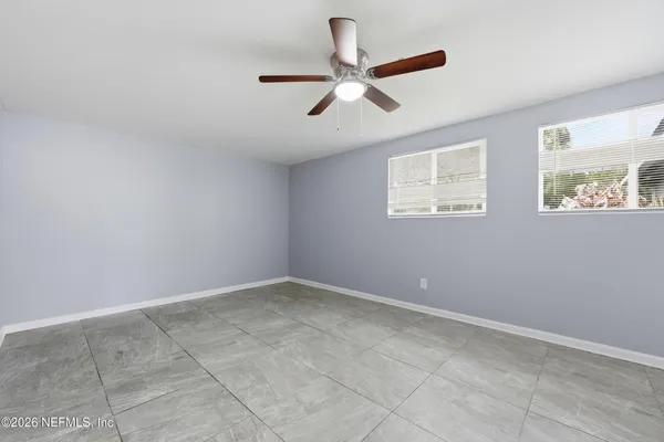 a view of an empty room with a window