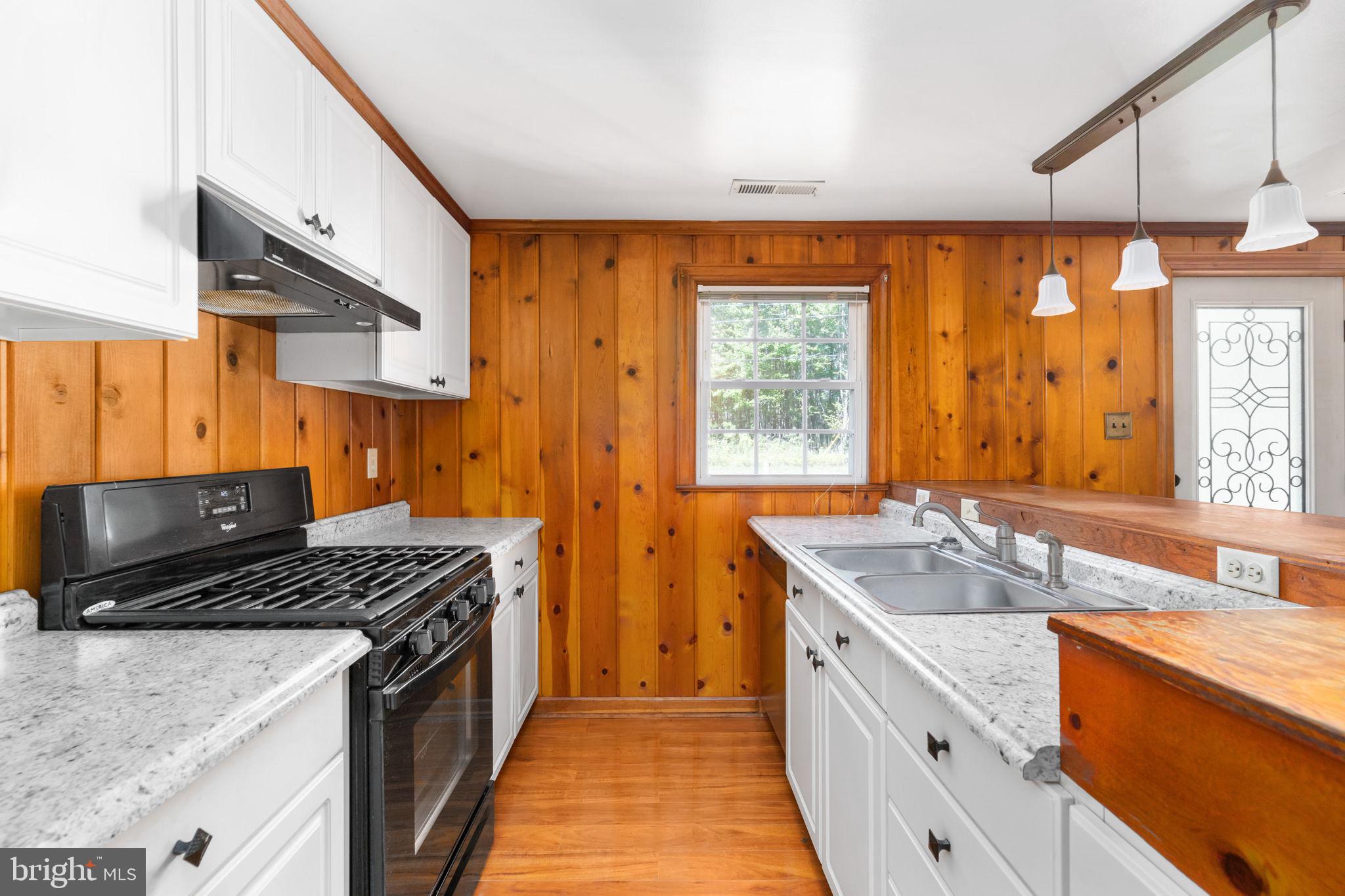 330 Long Point Road Hague, VA 22469 - Photo 11 of 41 Galley kitchen white cabinets